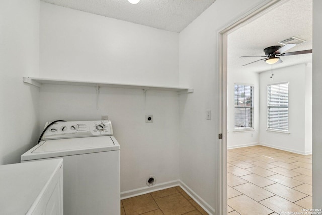 washroom featuring ceiling fan, washer / dryer, a textured ceiling, and light tile patterned floors