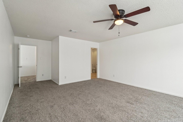 unfurnished bedroom with ceiling fan, carpet floors, and a textured ceiling