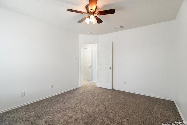 carpeted empty room with a textured ceiling and ceiling fan