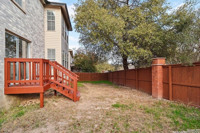 view of yard with a wooden deck