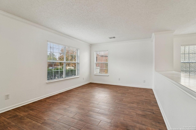 unfurnished room featuring ornamental molding, dark hardwood / wood-style flooring, and a textured ceiling