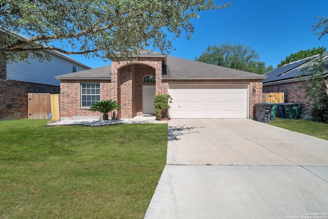 ranch-style house featuring a garage and a front lawn