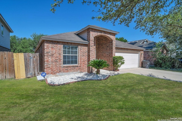 view of front of house featuring a garage and a front yard