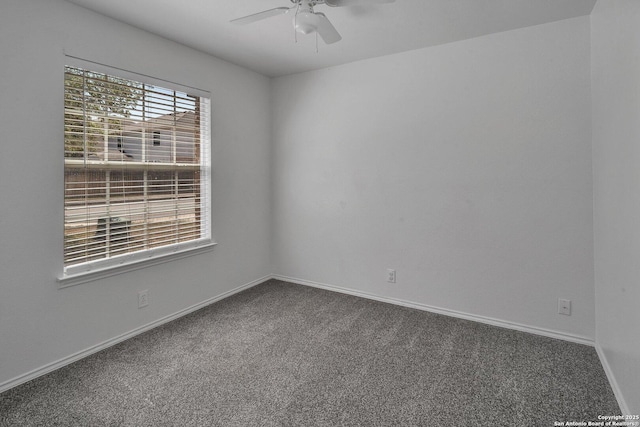 empty room featuring ceiling fan and carpet floors