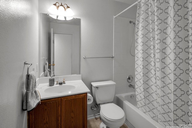 full bathroom with vanity, tiled shower / bath, and toilet