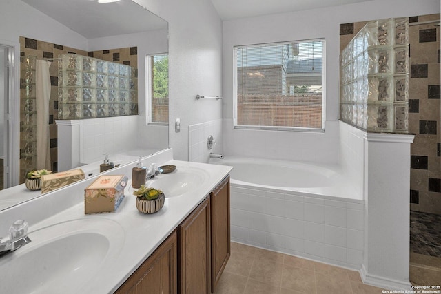 bathroom with vanity, tile patterned floors, and separate shower and tub