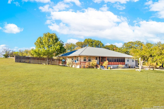 rear view of house with a yard