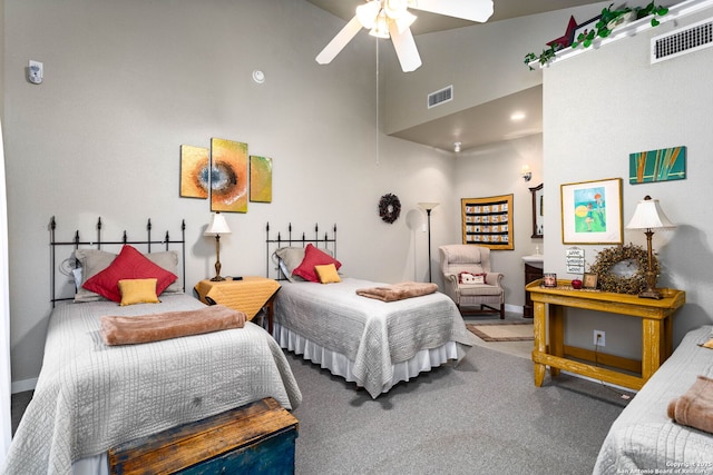 carpeted bedroom featuring ceiling fan and high vaulted ceiling