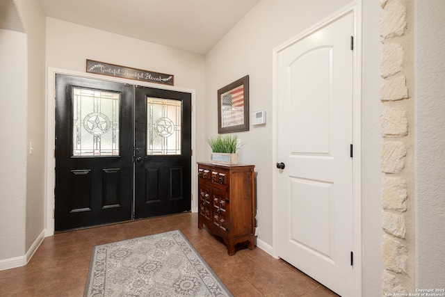 tiled entrance foyer with french doors