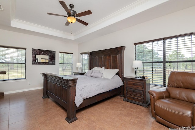 tiled bedroom with crown molding, ceiling fan, and a tray ceiling