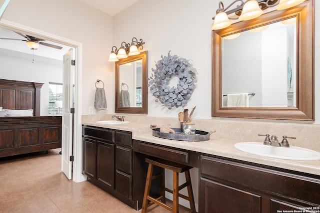 bathroom featuring ceiling fan, tile patterned floors, and vanity