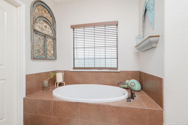 bathroom featuring a relaxing tiled tub