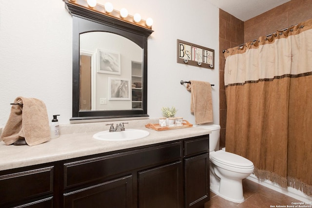 bathroom featuring a shower with curtain, tile patterned floors, toilet, and vanity