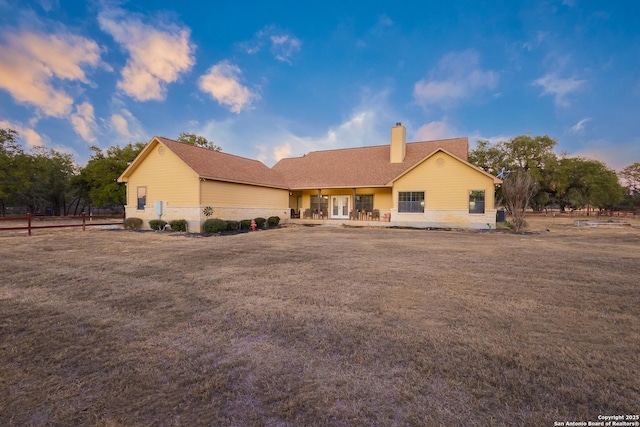 view of front of home with a lawn