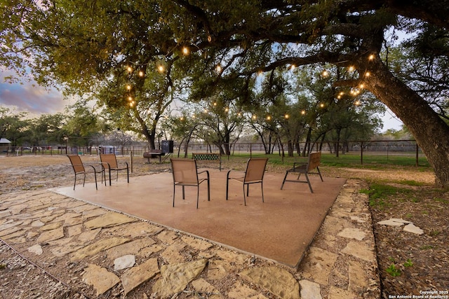 view of patio terrace at dusk