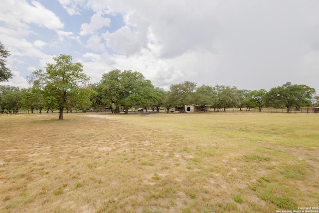 view of yard with a rural view