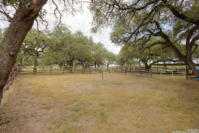 view of yard with a rural view