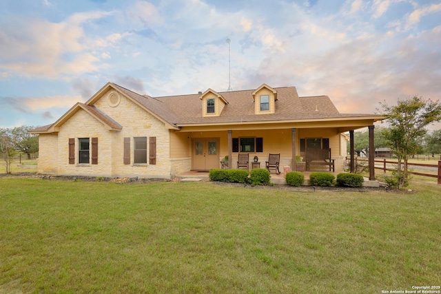 view of front facade featuring a lawn and a porch