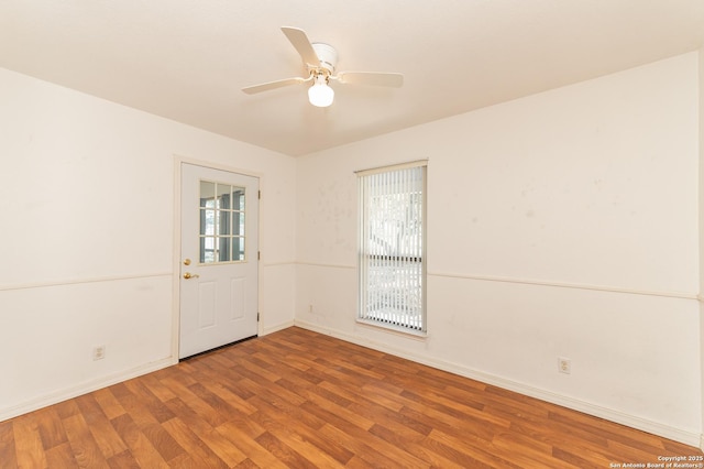 unfurnished room featuring ceiling fan and hardwood / wood-style floors