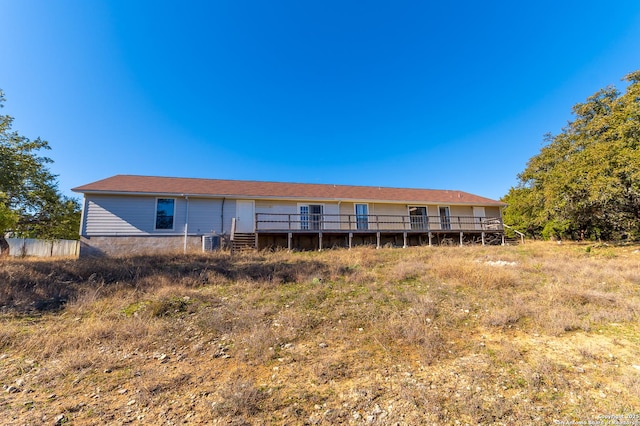 rear view of house with cooling unit