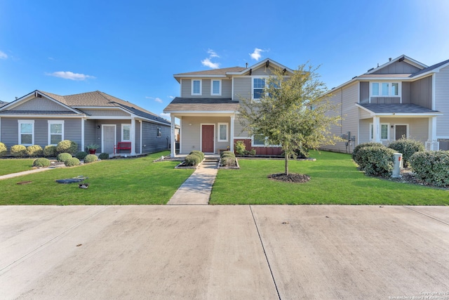 craftsman-style house with covered porch and a front lawn