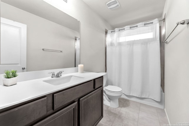 full bathroom with tile patterned floors, vanity, toilet, and shower / tub combo