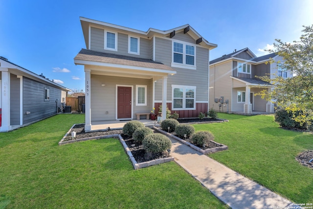 view of front of home featuring central AC unit and a front lawn