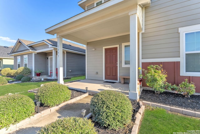 property entrance with covered porch