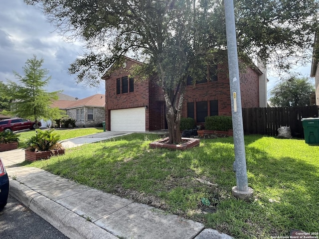 view of front facade featuring a garage and a front yard