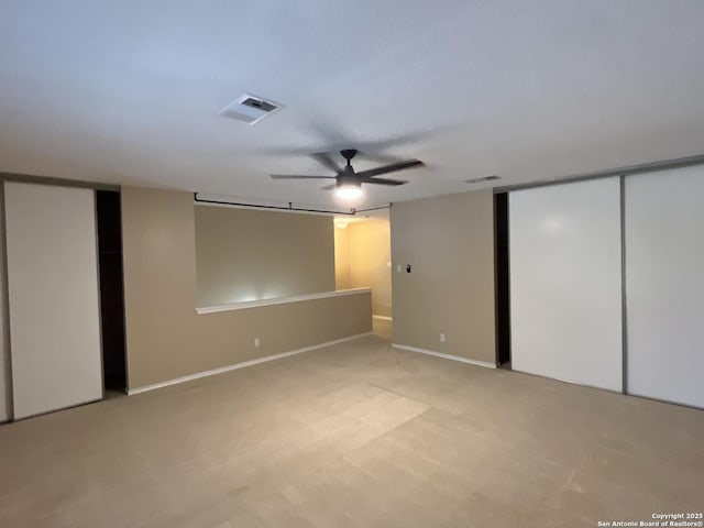 interior space featuring ceiling fan