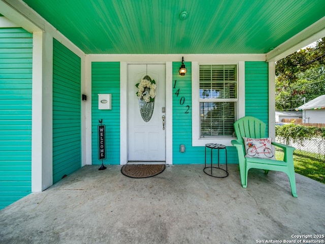 doorway to property with covered porch