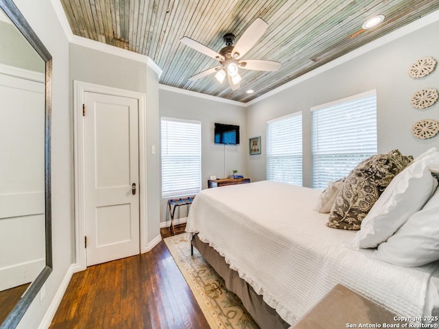 bedroom with crown molding, wooden ceiling, dark hardwood / wood-style floors, and ceiling fan