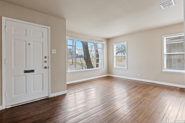 foyer entrance with dark hardwood / wood-style flooring