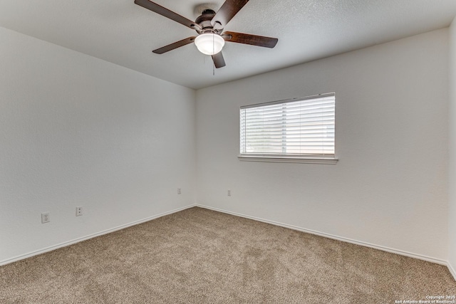 empty room with carpet floors and ceiling fan