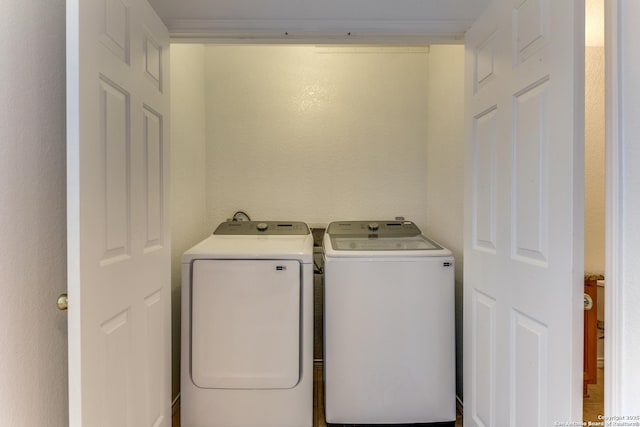 washroom featuring washer and dryer