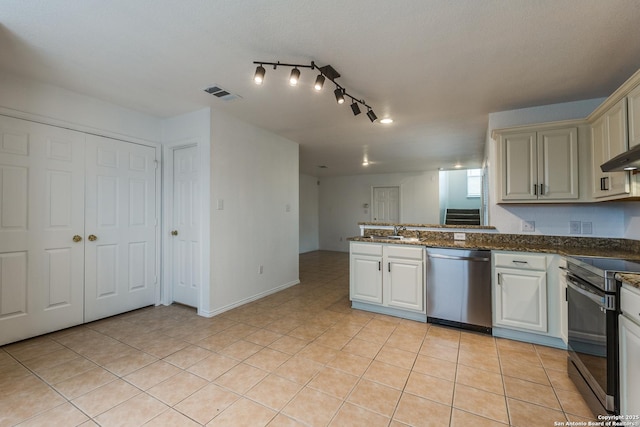 kitchen with sink, light tile patterned floors, electric range, stainless steel dishwasher, and kitchen peninsula