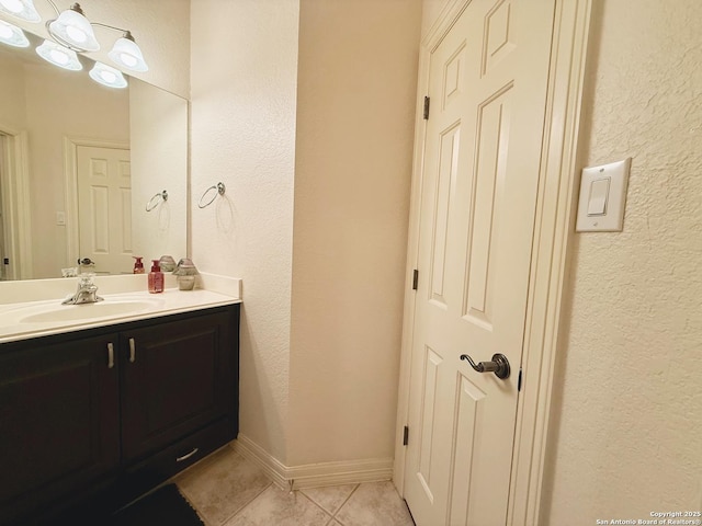 bathroom with tile patterned flooring and vanity