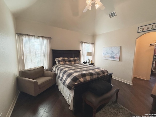 bedroom featuring ceiling fan, dark wood-type flooring, and high vaulted ceiling