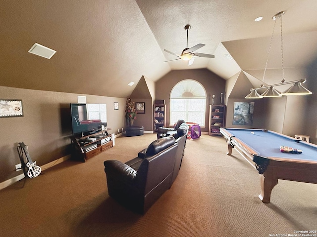 game room featuring lofted ceiling, ceiling fan, a textured ceiling, and carpet