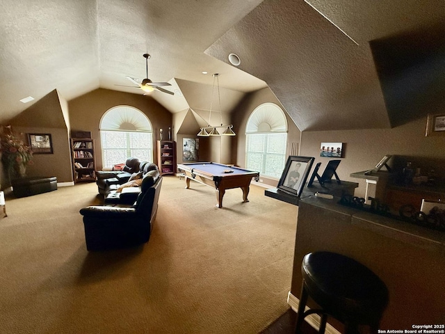 game room featuring vaulted ceiling, billiards, carpet flooring, ceiling fan, and a textured ceiling