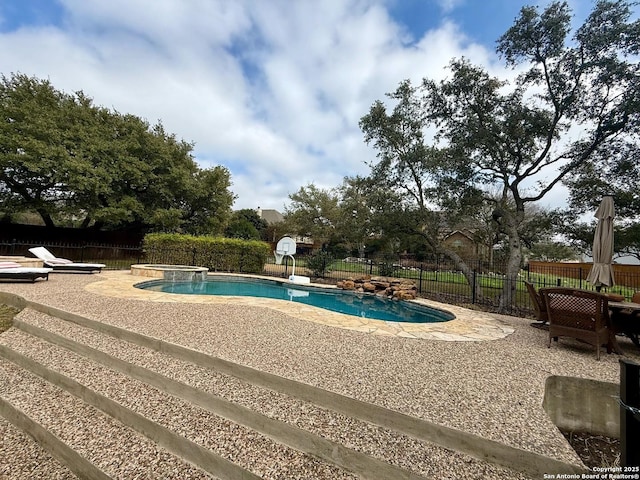 view of pool with a jacuzzi, a diving board, and a patio