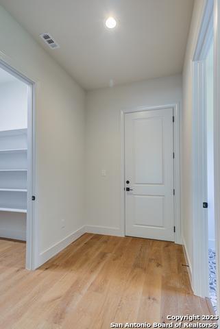 spare room with light wood-type flooring