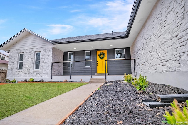 view of front of house with a front lawn and a porch