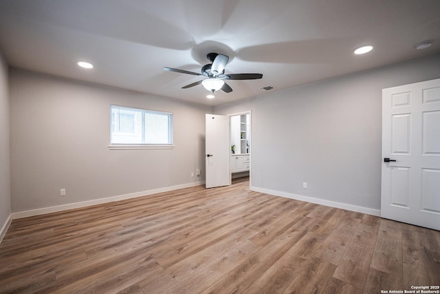 interior space with light hardwood / wood-style floors and ceiling fan