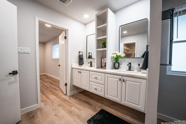 bathroom featuring vanity and hardwood / wood-style floors