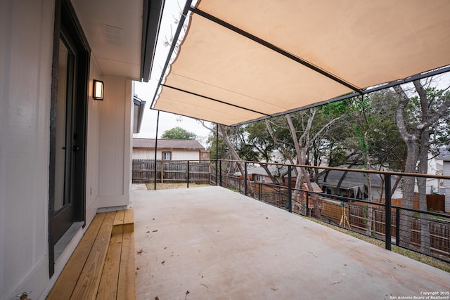 view of patio with a balcony