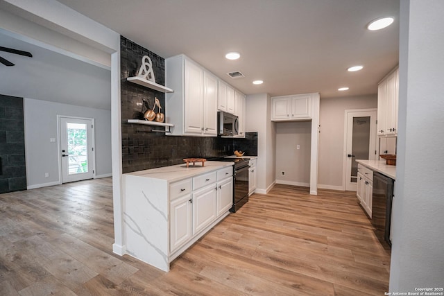 kitchen featuring ceiling fan, backsplash, black appliances, light hardwood / wood-style floors, and white cabinets