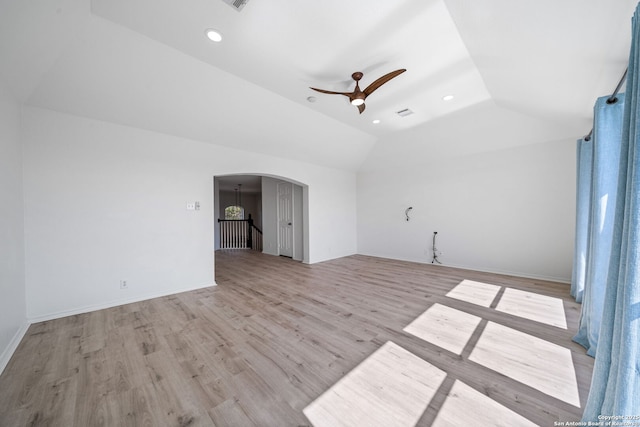 unfurnished room with ceiling fan, lofted ceiling, and light hardwood / wood-style flooring