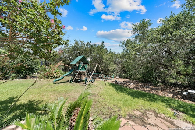 view of jungle gym featuring a lawn