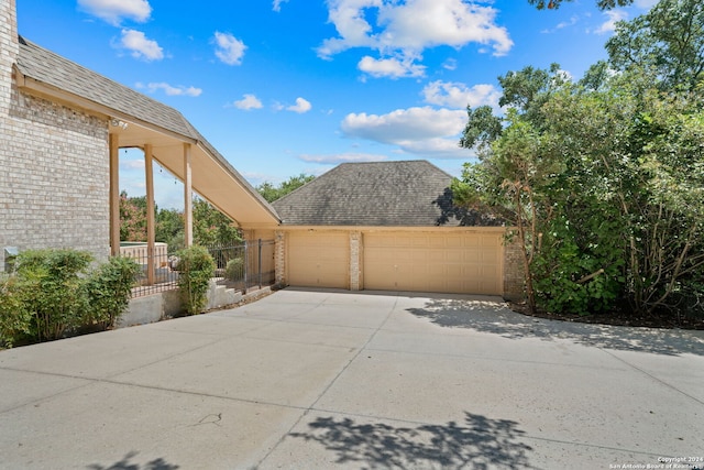 view of side of home featuring a garage